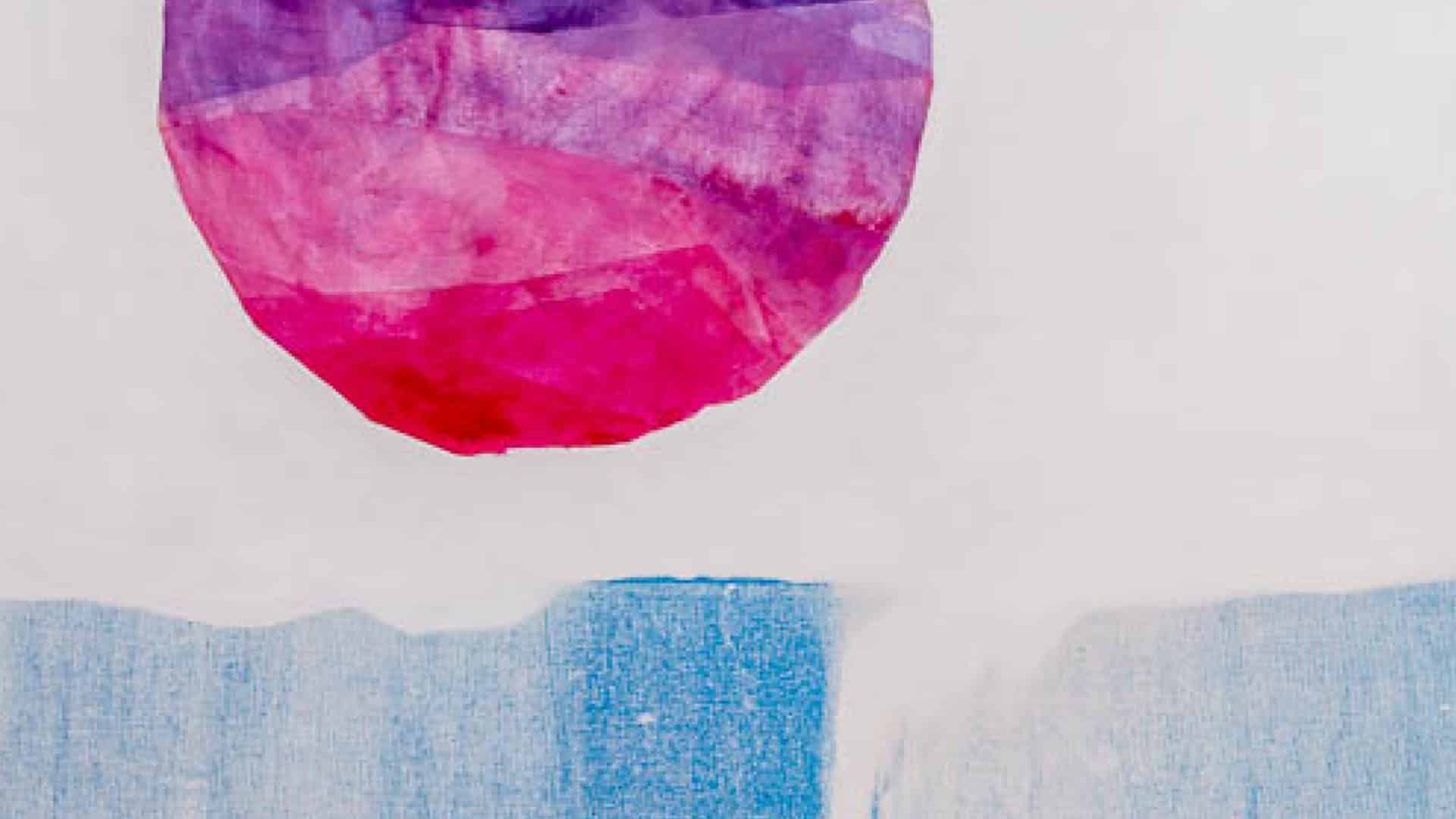 A textured, abstract close-up featuring a large, layered full moon circle in vibrant shades of magenta, violet, and soft pink. It floats above a horizontal band of light blue textured brush strokes, set against a clean white background.