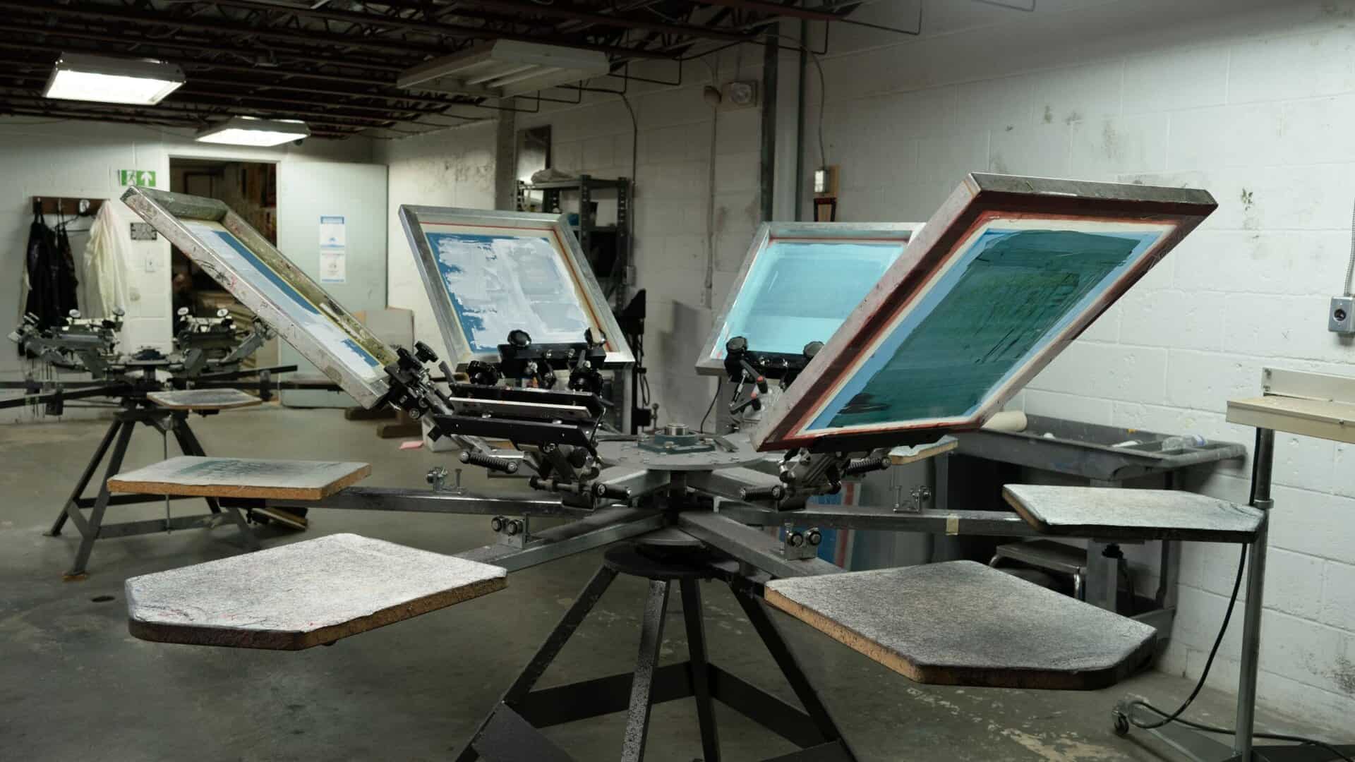 Equipment and print tables in the Screen Printing Studio.