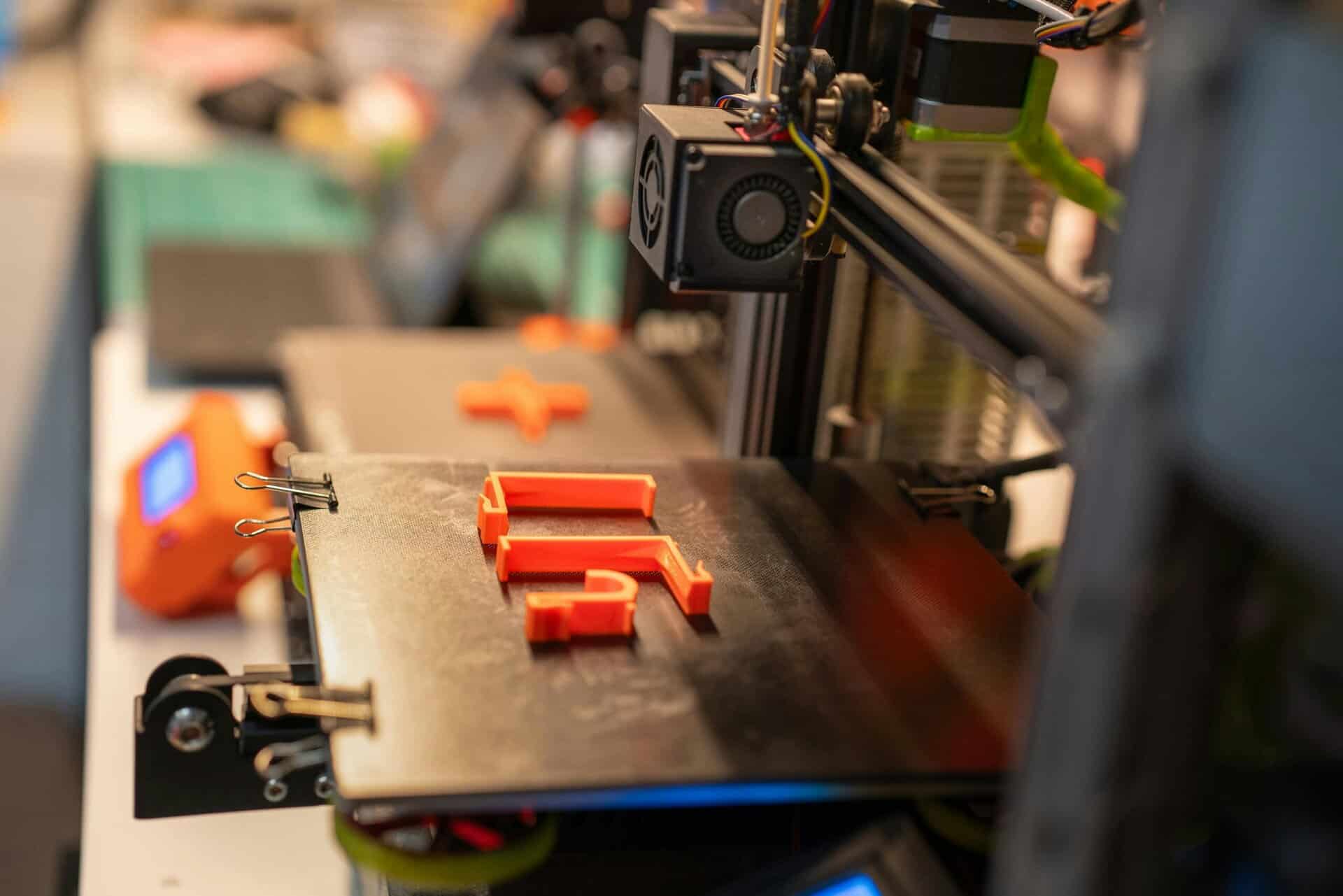 A 3D printer building an object on its print bed in the Digital Printing Studio.