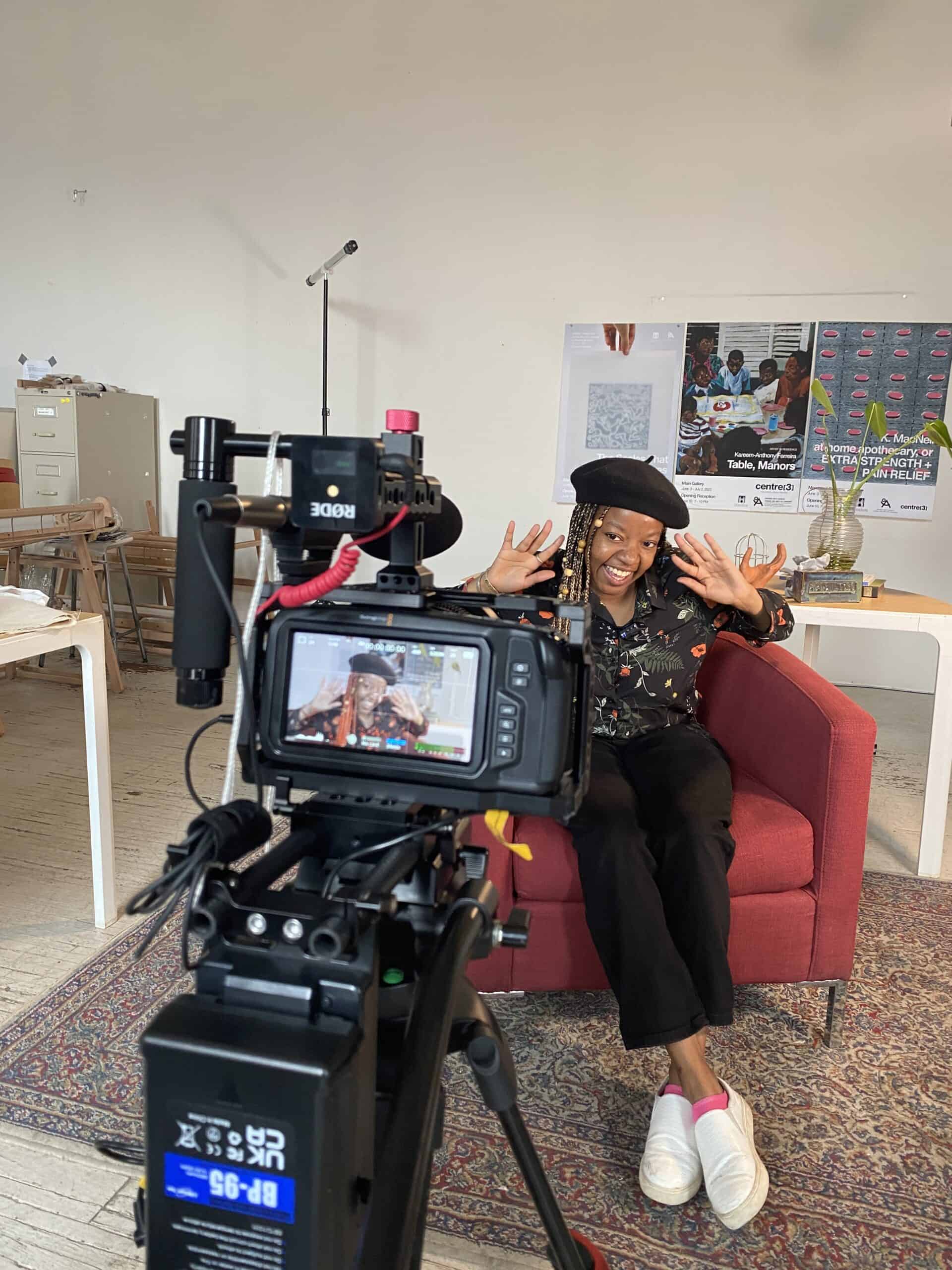 Inside the Media Arts Studio: a film set with studio lighting, camera equipment, and crew at work.