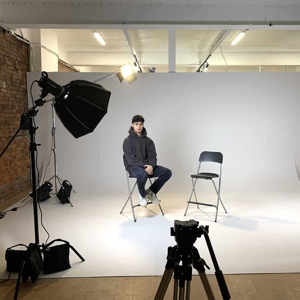 A photography setup in the Media Arts Studio with lighting and backdrop.