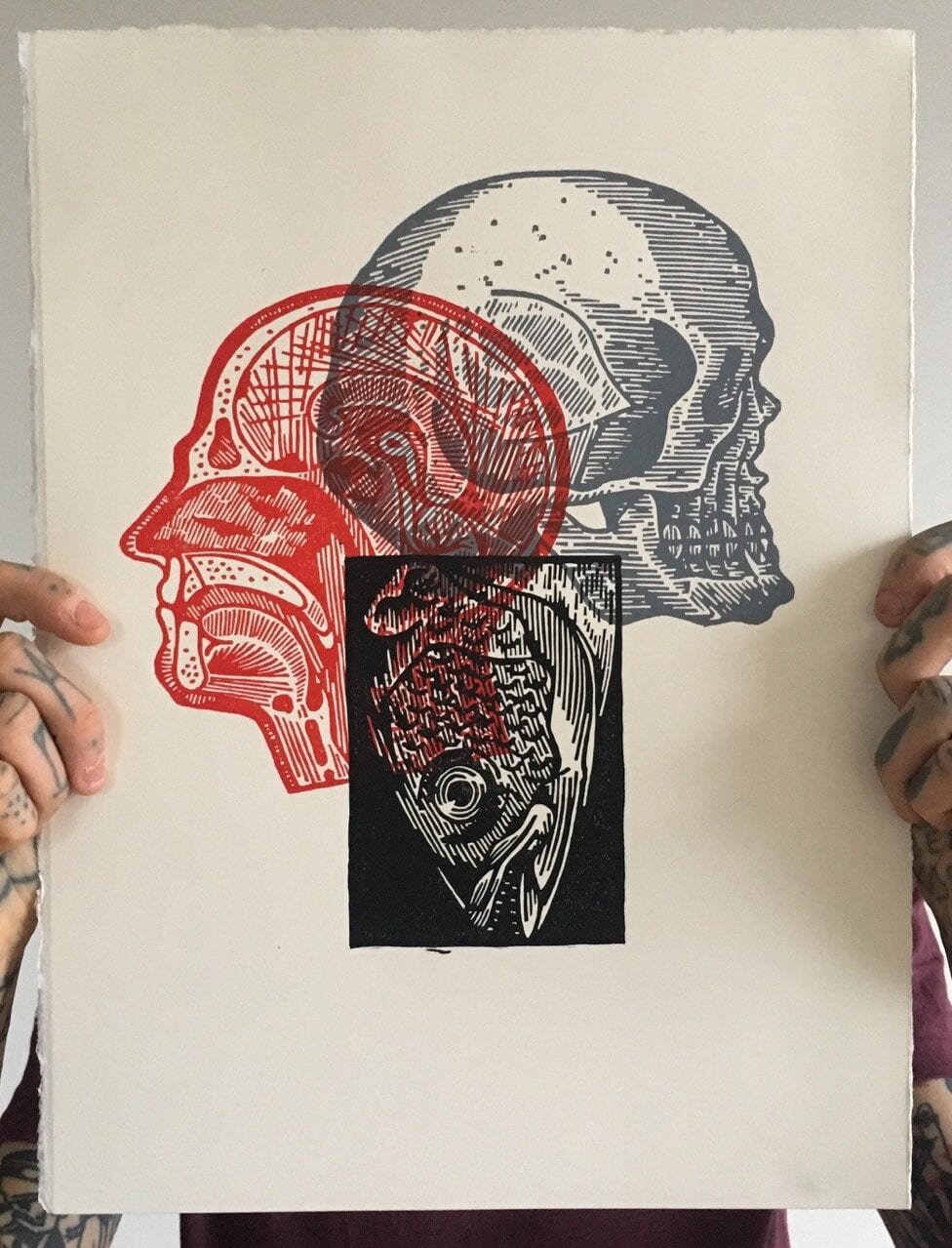 A relief print with overlapping illustrations.