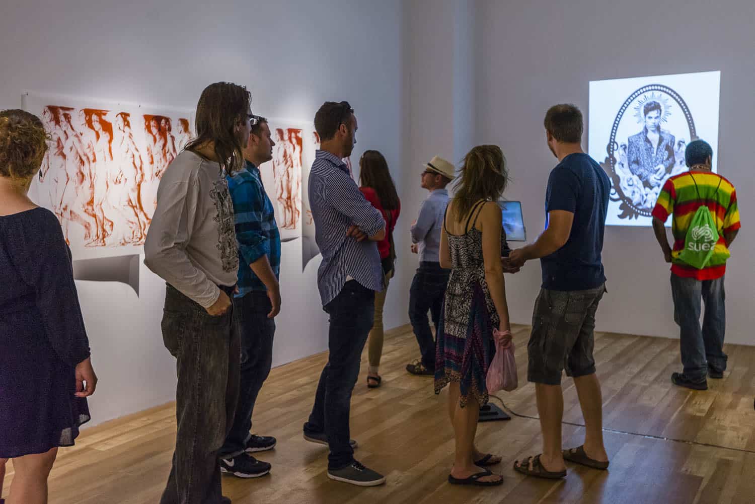 Guests gathered at a Centre[4]Arts exhibition.