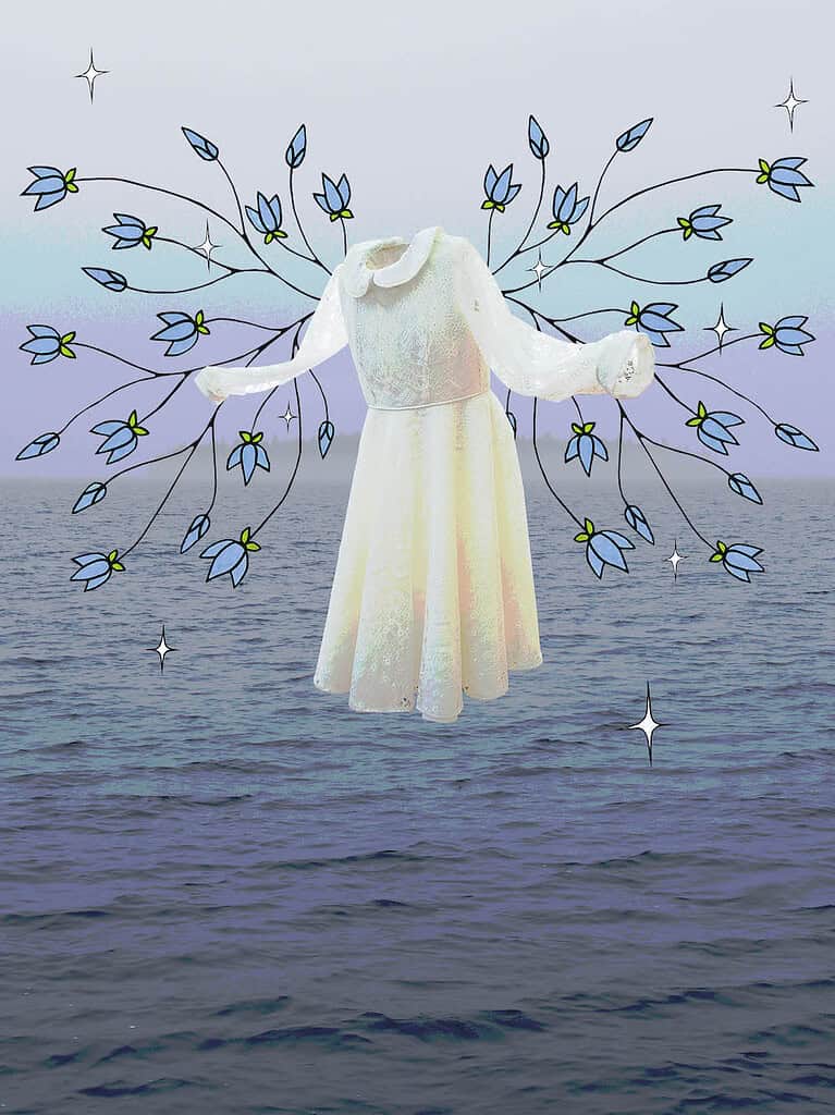 White dress suspended against an ocean backdrop with illustrated blue flowers extending outward like branches