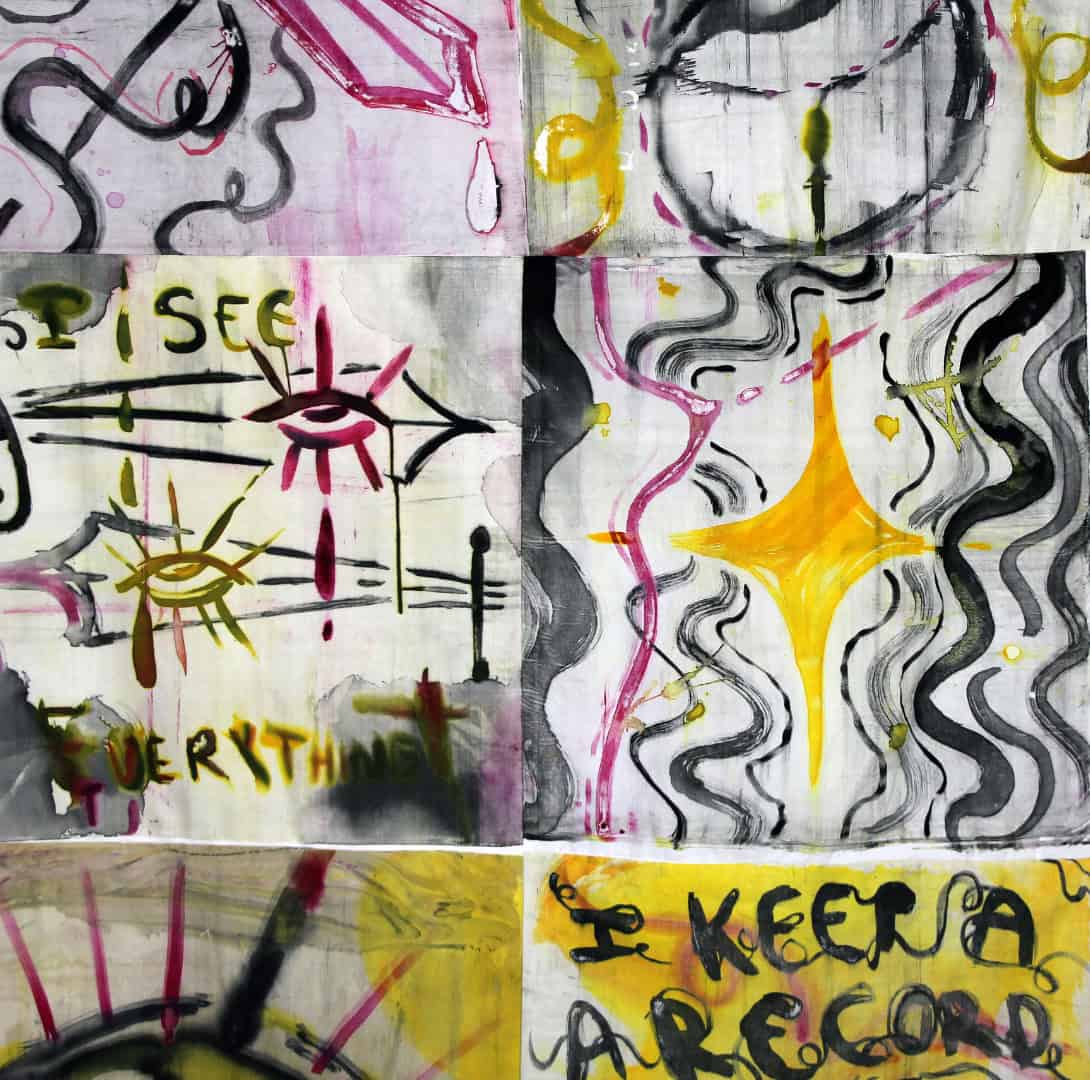 A vibrant grid of polychromatic screen prints on fabric. The panels feature expressive, hand-drawn motifs including eyes, stars, and abstract calligraphy in bold yellow, magenta, and black ink.